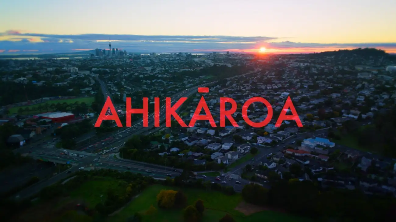 'Ahikāroa' title graphic against the Auckland skyline.