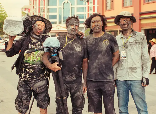 Camera assistant Gary Liu, DOP Mike Single, driver Chen Shan and researcher Joshua Cheng in the aftermath of the Monihei Carnival in Yunnan.