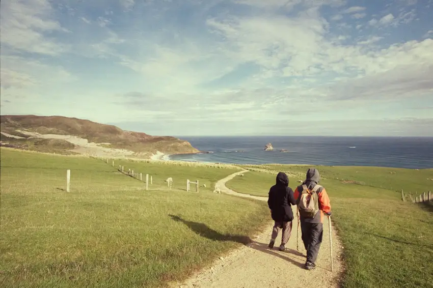 Mum and Dad walking down to Sandfly Bay, Dunedin.