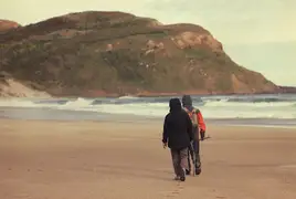 Mum and Dad exploring Sandfly Bay.