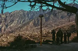 The crew plan a shot from the monastery overlooking the mountainside village of Zhonglu, Sichuan.