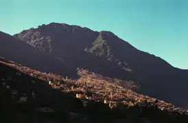 The low winter sun skims the mountain ridges around Zhonglu Village, Sichuan.