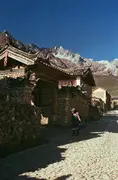 A local Naxi woman goes for a walk around Yuhu Village.