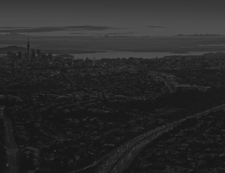 Aerial view of Auckland City at sunrise, shot by Unko Films