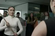 Geo holds a staff, ready to strike, in a law firm.
