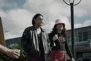 Kid and Kuīni walk the streets.