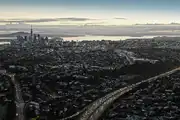 Aerial view of Auckland City at sunrise, shot by Unko Films