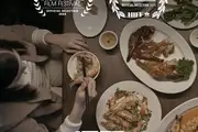Still from Let's Settle This! - top down view of table full of food with HIFF and San Diego Film Festival laurels